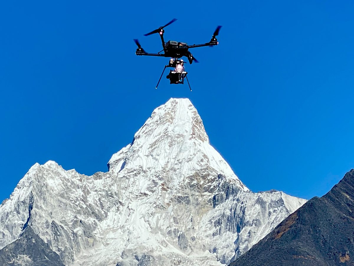 drone flying at high altitude by Ama Dablam